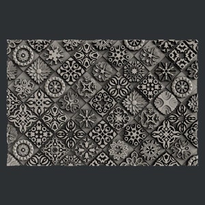 May include: A 3D printed wall panel with a repeating pattern of black and white geometric shapes. The panel is made up of a variety of different designs, including circles, squares, and stars.