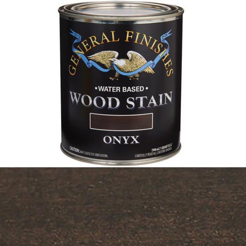 May include: A can of General Finishes water-based wood stain in the color Onyx. The can is black with gold lettering and a small American flag.