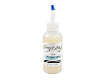May include: A clear plastic bottle of pouring resin with a blue cap. The bottle is labeled "Paint Couture" and "Pouring Resin". The bottle contains 4 fl oz (118 ml) of resin.