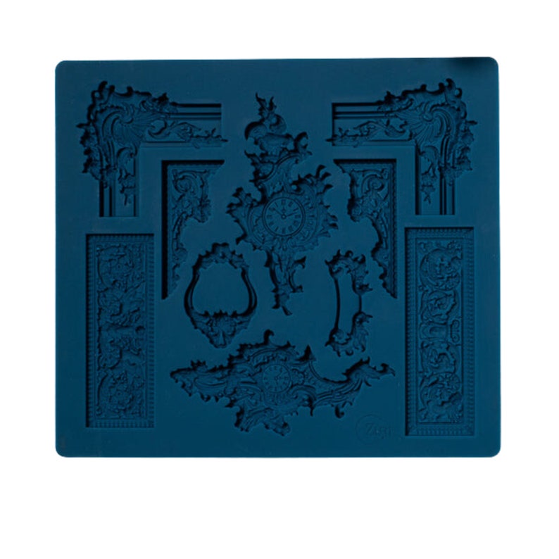 May include: A teal-colored silicone mold featuring various ornate, baroque-style decorative elements. The mold includes clock faces, picture frames, corner pieces, and rectangular panels with detailed floral and scrollwork designs. The elements are raised and ready for use.