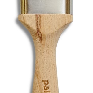 May include: A pink angled paint brush with a wooden handle. The handle has the words "Paint Couture" engraved on it.