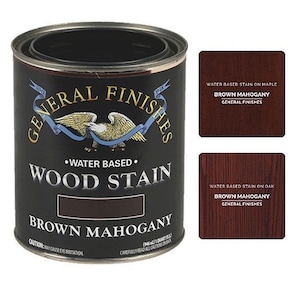 May include: A can of General Finishes water-based wood stain in the color Brown Mahogany. The can is black with a gold eagle logo and the text "General Finishes" in a gold circle. The can is labeled "Water Based Wood Stain" and "Brown Mahogany".