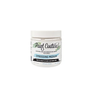 May include: A white jar of Paint Couture Embossing Medium, used to create an aged and worn look. The jar is labeled with the brand name, product name, and instructions for use. It is water-based and contains 4 fluid ounces (118 ml).