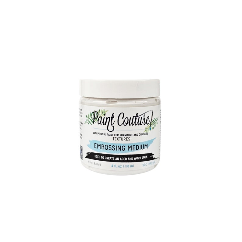 May include: A white jar of Paint Couture Embossing Medium, used to create an aged and worn look. The jar is labeled with the brand name, product name, and instructions for use. It is water-based and contains 4 fluid ounces (118 ml).