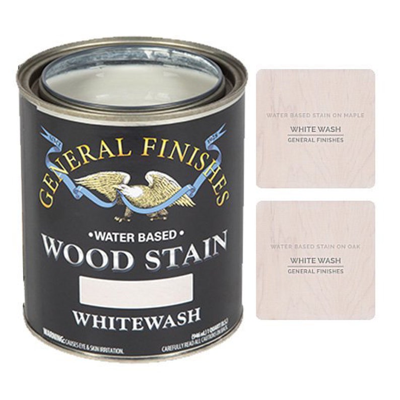 May include: A can of General Finishes Water Based Wood Stain in Whitewash. The can is black with gold lettering and an eagle logo. The label also includes the text "Water Based" and "Wood Stain".