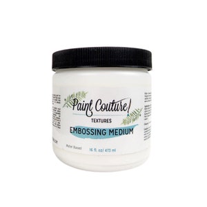 May include: A white plastic jar with a black lid containing Paint Couture Textures Embossing Medium. The jar is labeled "Water Based" and "16 fl. oz/473 ml".