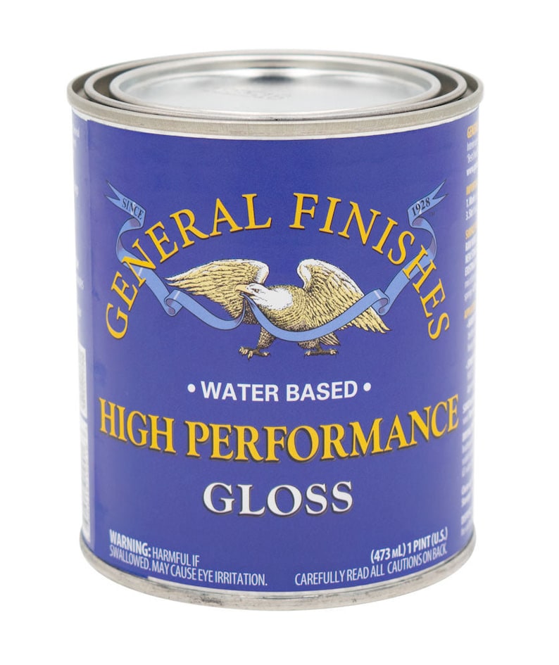 May include: A blue can of General Finishes High Performance Gloss water-based paint. The can has a label with a bald eagle and the text "Since 1928". The can is 1 pint (473 ml).
