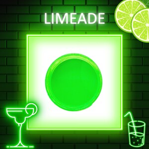 May include: Neon sign with the word "Limeade" in green letters. A green circle is in the center of a white square with a neon green border. A green glass of limeade with a straw and a green margarita glass with a lime wedge are on either side of the square.