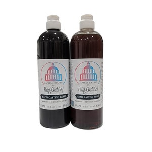 May include: Two 16-ounce bottles of black resin labeled "Capital Crafts by Paint Couture!" Rapid Casting Resin. Step 1 and Step 2 are labeled on the bottles.