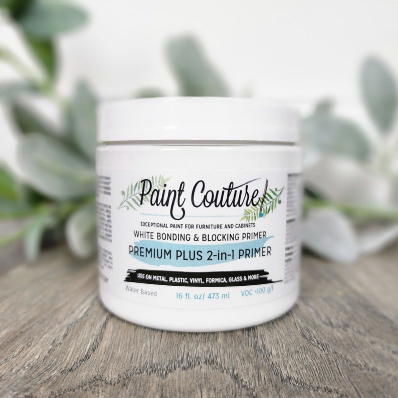May include: A white plastic jar of Paint Couture Premium Plus 2-in-1 Primer. The jar is labelled "Exceptional Paint for Furniture and Cabinets" and "White Bonding & Blocking Primer". The jar is 16 fluid ounces (473 ml) and is water-based.