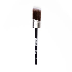 May include: A black angled paint brush with a silver ferrule and white bristles. The brush has the text "CLING ON!!" and "FA40" printed on the handle.