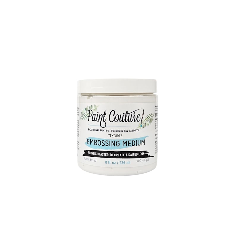 May include: A white jar of Paint Couture Embossing Medium, an acrylic plaster to create a raised look. The jar is labeled with the brand name, product name, and instructions for use. It is water-based and contains 8 fluid ounces (236 ml).