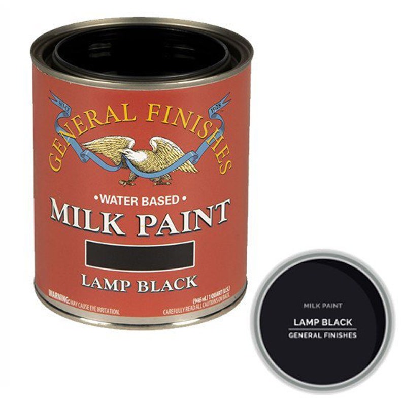 May include: A can of General Finishes Milk Paint in Lamp Black. The can is red with a white eagle and the words "General Finishes" and "Milk Paint" in black. The can is 946 ml (1 quart).