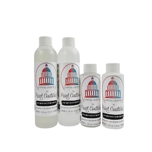 May include: Four white plastic bottles of clear resin, labeled "Capital Crafts by Paint Couture." The bottles vary in size, with the largest containing 8 fl. oz. and the smaller ones 4 fl. oz. each. The labels feature a red, white, and blue capitol building design.