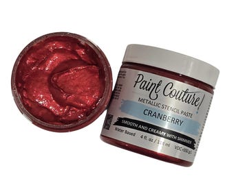 May include: A jar of cranberry metallic stencil paste by Paint Couture. The paste is smooth and creamy with shimmer and is water-based. The jar is 4 fluid ounces or 118 milliliters.