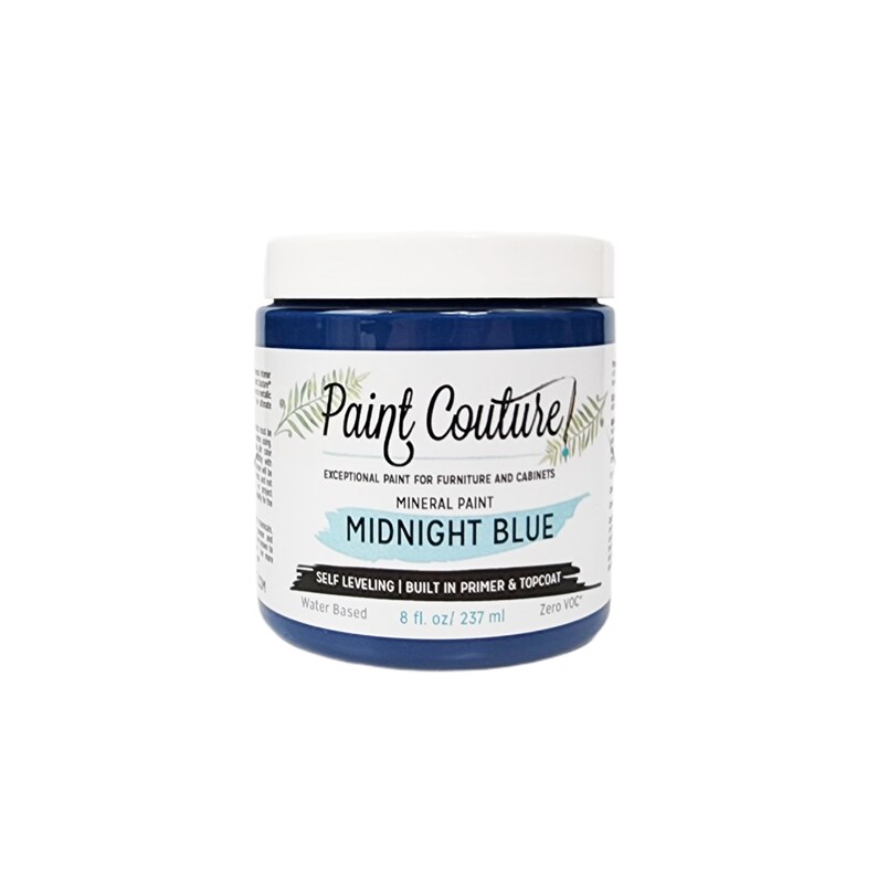 May include: A jar of Midnight Blue mineral paint by Paint Couture. The paint is self-leveling and has a built-in primer and topcoat. It is water-based and zero VOC. The jar is 8 fluid ounces or 237 milliliters.