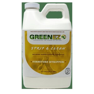 May include: A white plastic jug with a green and yellow label. The label reads "GREENEZ HARNESSING THE POWER OF NATURE STRIP & CLEAN NO MORE HARSH/CAUSTIC CHEMICALS FURNITURE STRIPPER 0.5 GALLON (1.89L)"