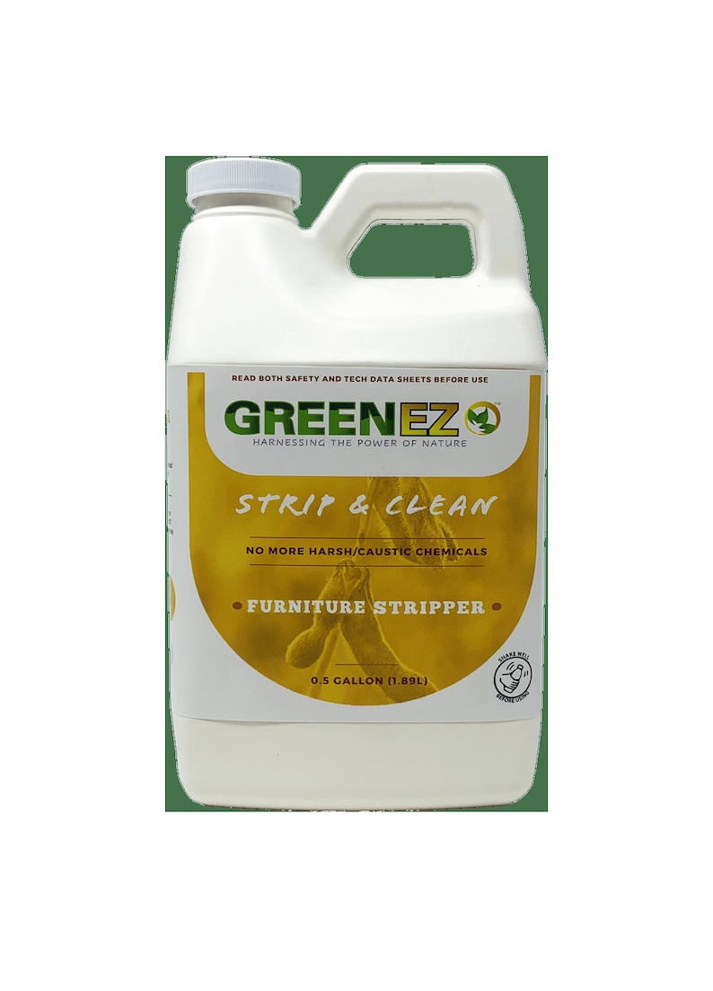 May include: A white plastic jug with a green and yellow label. The label reads "GREENEZ HARNESSING THE POWER OF NATURE STRIP & CLEAN NO MORE HARSH/CAUSTIC CHEMICALS FURNITURE STRIPPER 0.5 GALLON (1.89L)"