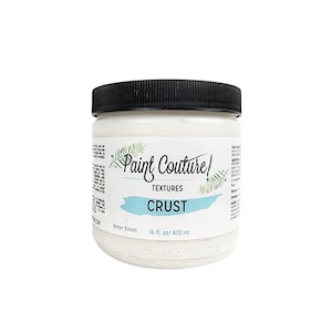 May include: A white jar of Paint Couture Textures Crust, a water-based paint for creating textured surfaces. The jar is labeled with the brand name, product name, and size: 16 fl. oz./473 ml.