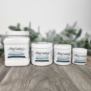 May include: Three bottles of white bonding and blocking primer labelled "Paint Couture Premium Plus 2-in-1 Primer". The bottles are in different sizes, with the largest bottle being 32 fl oz (946 ml), the middle bottle being 16 fl oz (473 ml), and the smallest bottle being 8 fl oz (237 ml).