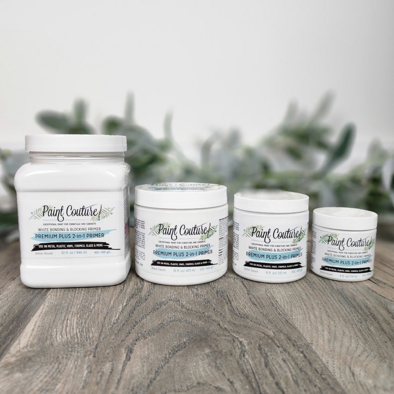 May include: Three bottles of white bonding and blocking primer labelled "Paint Couture Premium Plus 2-in-1 Primer". The bottles are in different sizes, with the largest bottle being 32 fl oz (946 ml), the middle bottle being 16 fl oz (473 ml), and the smallest bottle being 8 fl oz (237 ml).