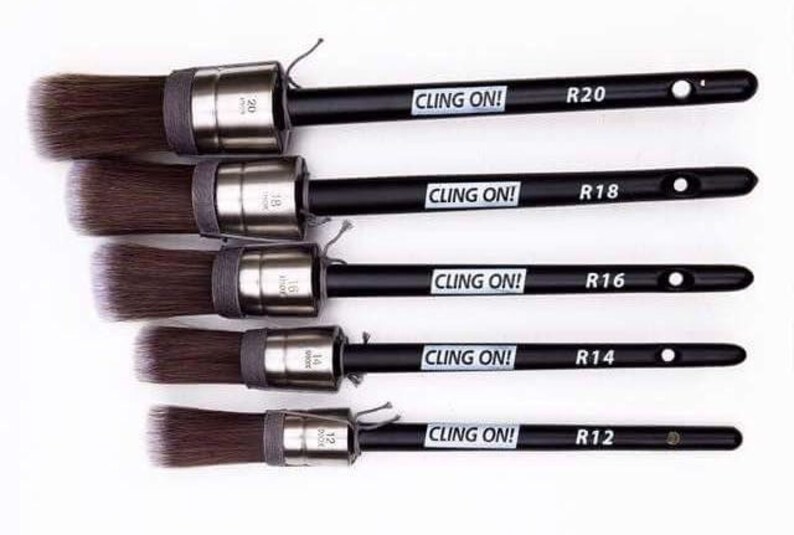May include: Five black handled paint brushes with silver ferrules and brown bristles. The handles are labeled "CLING ON!" and "R20", "R18", "R16", "R14", and "R12".