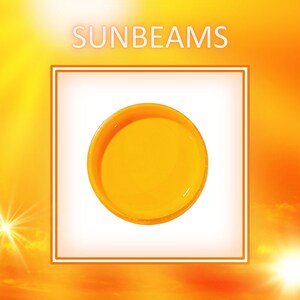 May include: A bright yellow round object with a smooth surface. The object is in a white square frame against a yellow and orange background.