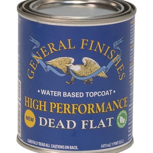 May include: A blue can of General Finishes High Performance Dead Flat water-based topcoat. The can has a gold eagle logo and the text "New" in a yellow circle.