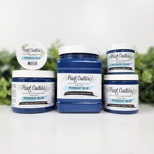 May include: Four bottles of Midnight Blue mineral paint by Paint Couture. The bottles are different sizes and are arranged in a row on a white surface. The paint is self-leveling and has a built-in primer and topcoat.