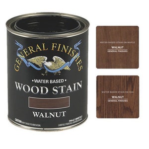 May include: A can of General Finishes water-based wood stain in the color Walnut. The can is black with a white label and a picture of a bald eagle. The label says "Water Based Wood Stain" and "Walnut".