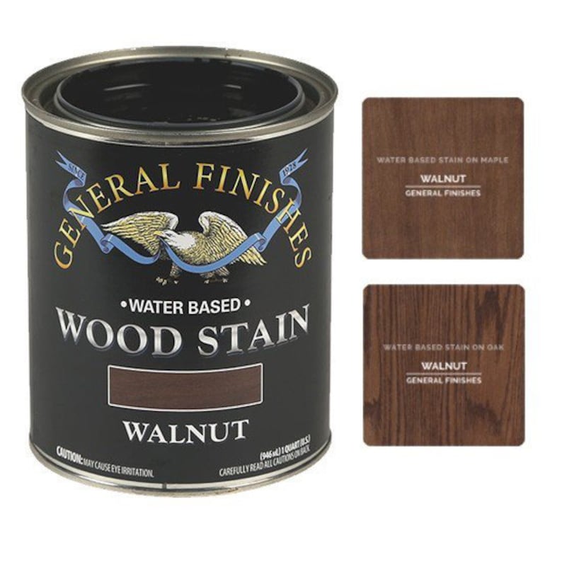 May include: A can of General Finishes water-based wood stain in the color Walnut. The can is black with a white label and a picture of a bald eagle. The label says "Water Based Wood Stain" and "Walnut".