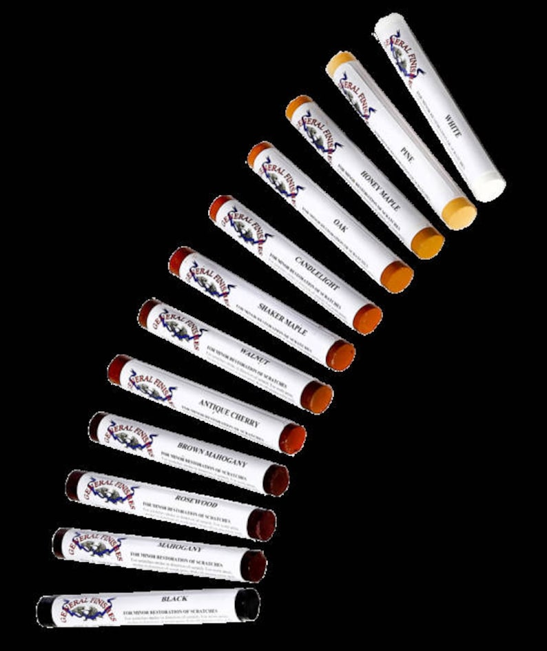 May include: A set of 12 wood stain markers in various shades, including black, mahogany, rosewood, brown mahogany, antique cherry, walnut, shaker maple, candlelight, oak, honey maple, pine, and white. The markers are labeled "General Finishes" and are designed for minor restoration of scratches.