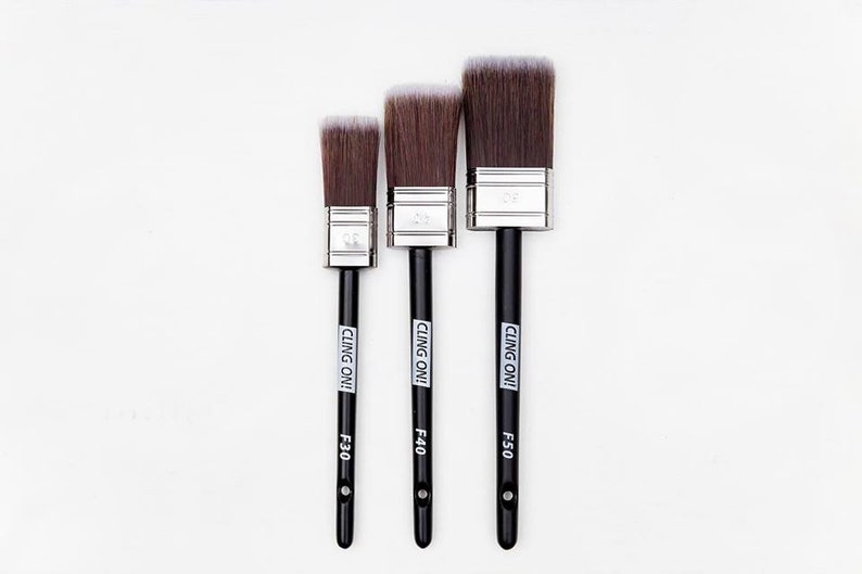 May include: Three paint brushes with black handles and silver ferrules. The brushes are labeled "CLING ON!" and have the sizes F30, F40, and F50.