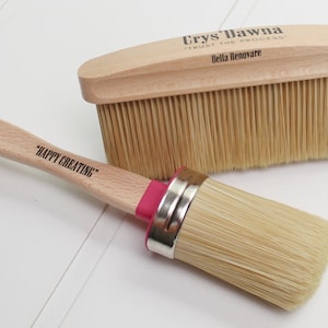 May include: Two paint brushes, one with a wooden handle and the text "Happy Creating" and the other with a wooden handle and the text "Crys' Dawna - Trust the Process - Bella Renovare".