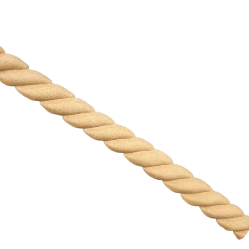 May include: A close-up of a wooden rope molding, a decorative trim for furniture or walls. The molding is made of natural wood and has a light brown color.