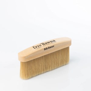 May include: A wooden brush with natural bristles. The handle is labeled "Crys' Dawna" and "Trust the Process" with the text "Bella Renovare" below.