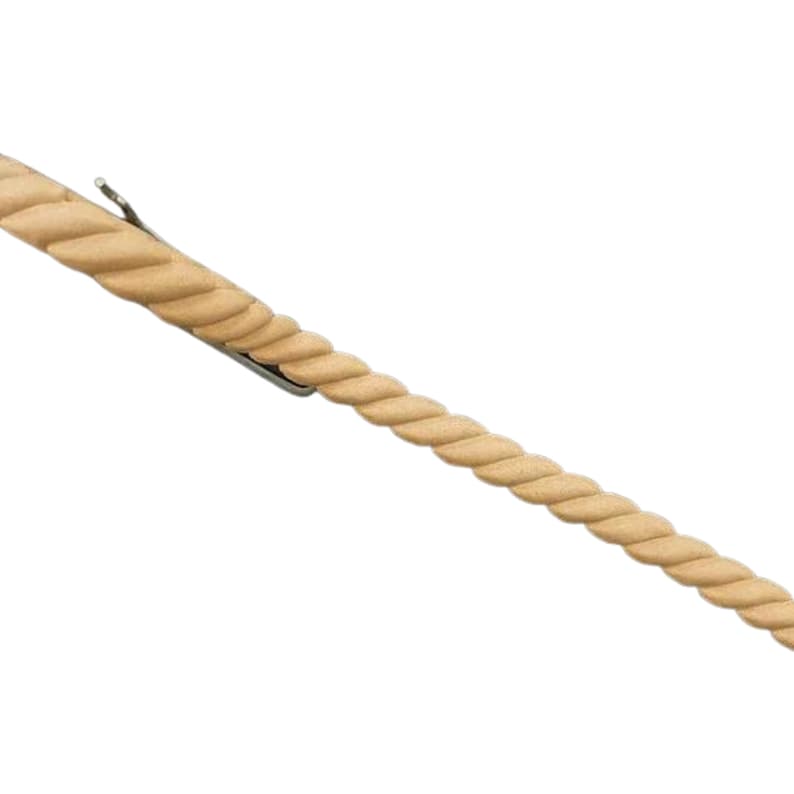 May include: A close-up of a beige rope trim molding. The molding is twisted and has a textured surface.