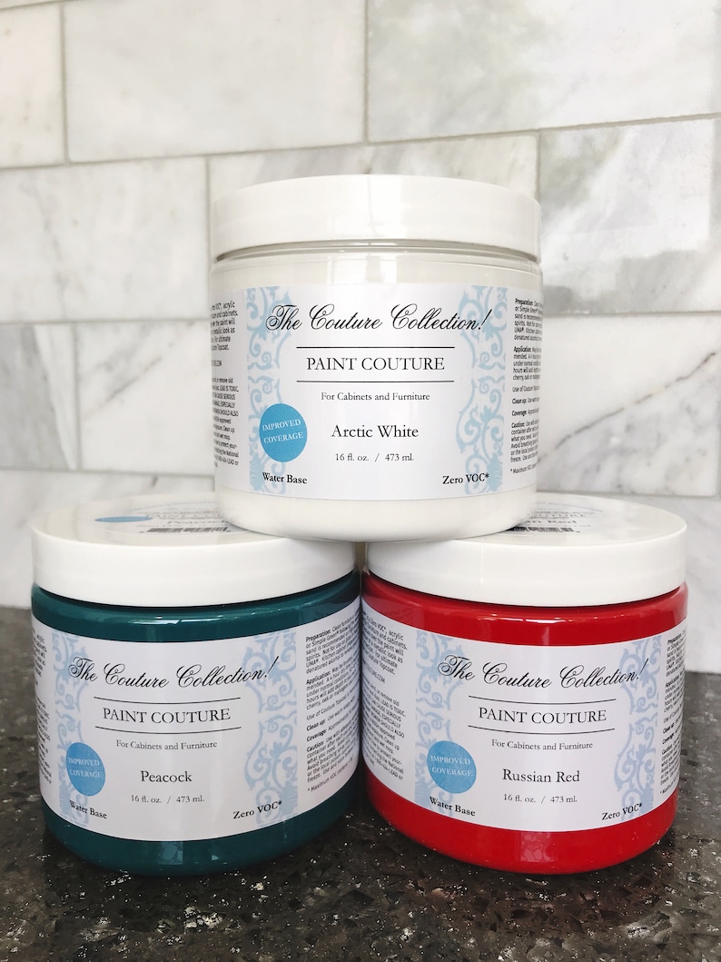 May include: Three 16-ounce jars of paint in the colours Arctic White, Peacock, and Russian Red. The jars are labelled "The Couture Collection!" and "Paint Couture" with the text "Improved Coverage" and "Water Base".