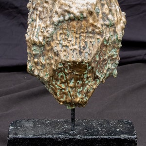 1/2 bronze egg sculpture mask image 1