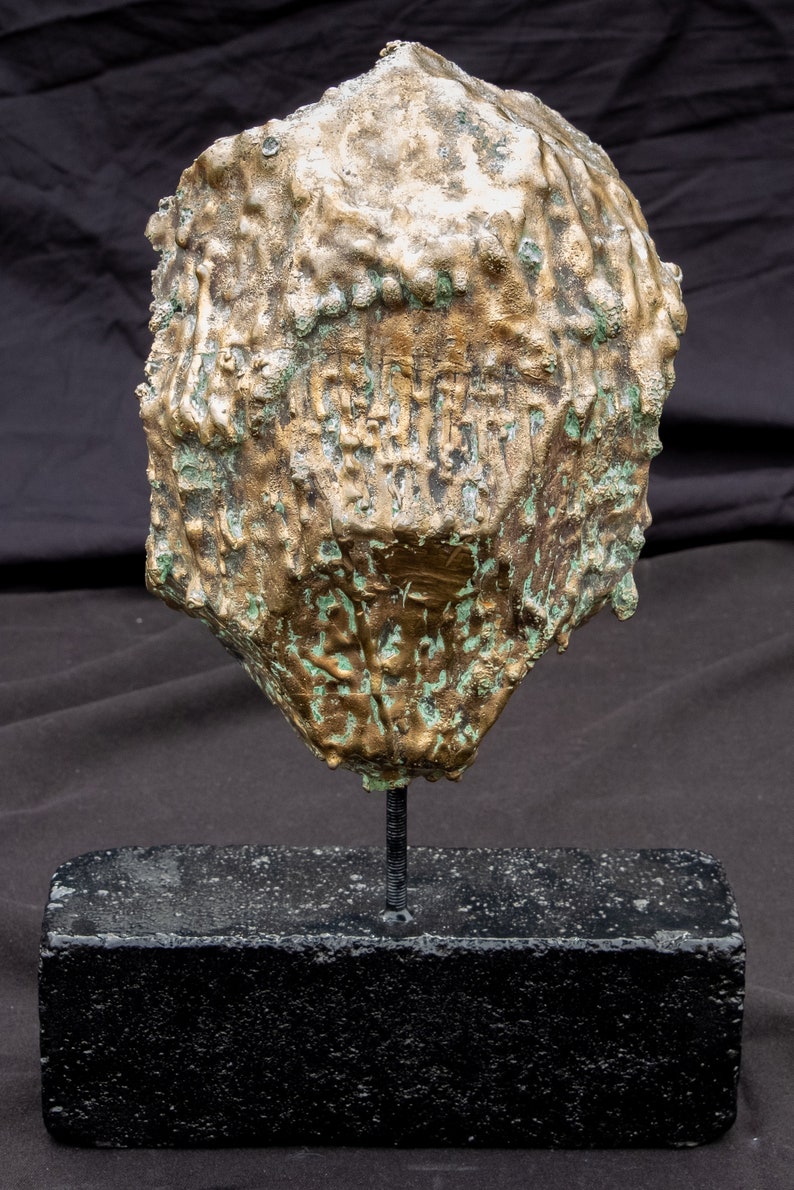 1/2 bronze egg sculpture mask image 1