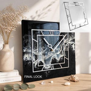 May include: A square black wall clock with a silver frame and Roman numerals. The clock face has a black and white abstract design. The words "FINAL LOOK" are printed on the bottom left of the clock.