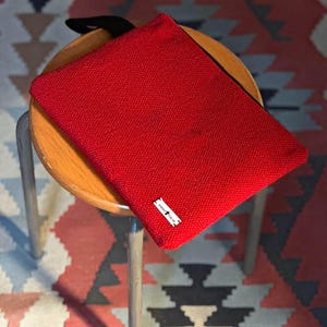 The very red woven clutch bag