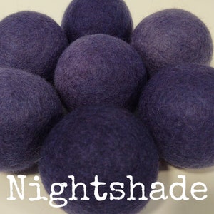 May include: A set of six wool dryer balls in a deep purple shade, called "Nightshade".