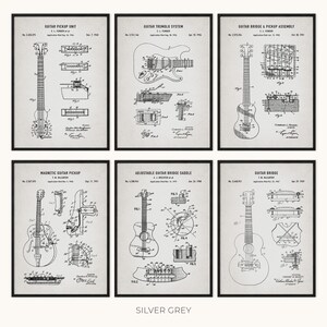 Peut inclure: Six impressions encadr&eacute;es de brevets de composants de guitare, dont un micro, un syst&egrave;me de tr&eacute;molo et un assemblage de chevalet. Les impressions sont en noir et blanc, avec des dessins techniques et du texte. Le fond est gris argent&eacute;.