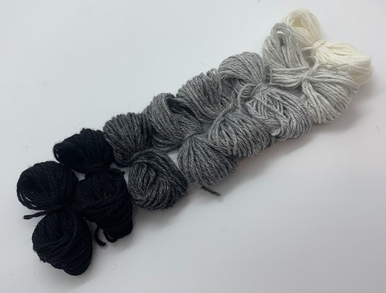 Pure cashmere darning yarn in various shades of black, through greys to cream thread, cashmere thread, darning thread, cashmere repair Cinzento