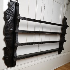 Antique plate rack with wood carving and two shelves 1900s Antique oak plate rack with hand carved face | Large decorative wall plate rack
