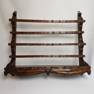 Antique oak wood carving rack for cups and saucers 1900s Antique oak plate rack with hand carved tassels | Small decorative plate rack