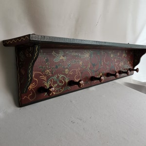 Vintage Hindeloopen folk art coat rack with six hooks 1980s Hand-painted red coat rack with birds and flowers | Red decorative coat rack