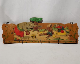Antique children coat rack with 5 hooks and images of an elephant and monkeys 1930s Antique nursery coat rack | Wall mount coat rack animals