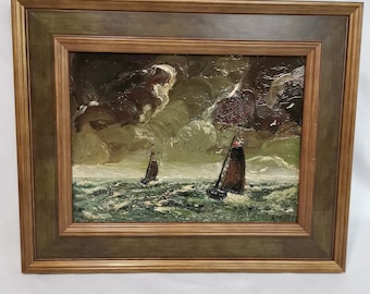 May include: Oil painting of two sailboats on a choppy sea under a cloudy sky. The artwork is framed in a wooden frame with a dark green inner border. The painting uses a palette of greens, browns, and whites to depict the seascape.